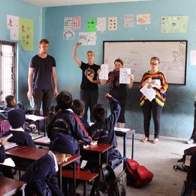 Childcare and Community volunteers teach children about dental hygiene at a school in Nepal. A group of Childcare volunteers team up to help children learn about good dental hygiene in Nepal, Asia.
